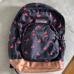 Jansport Trans backpack. Perfect for back to school. Black with cherries.